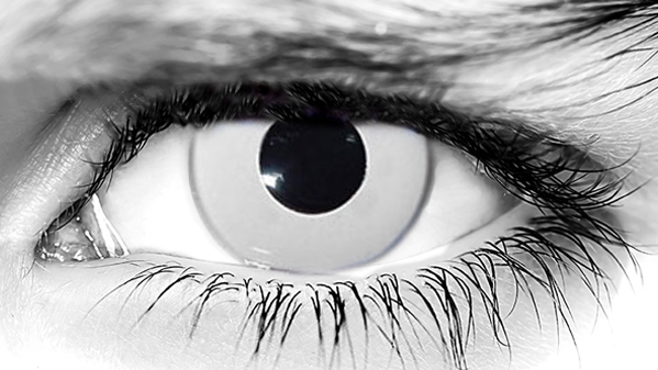 Person wearing white-out Prescription Zombie Contacts with special FX makeup